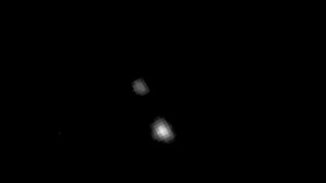 Very fuzzy picture of Pluto and its moon, Charon.