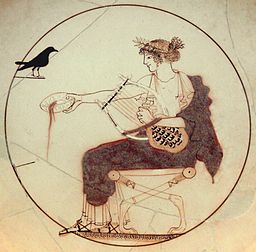 Apollo holding a lyre and pouring a libation, accompanied by a black bird. From a tomb at Delphi. Wikimedia.